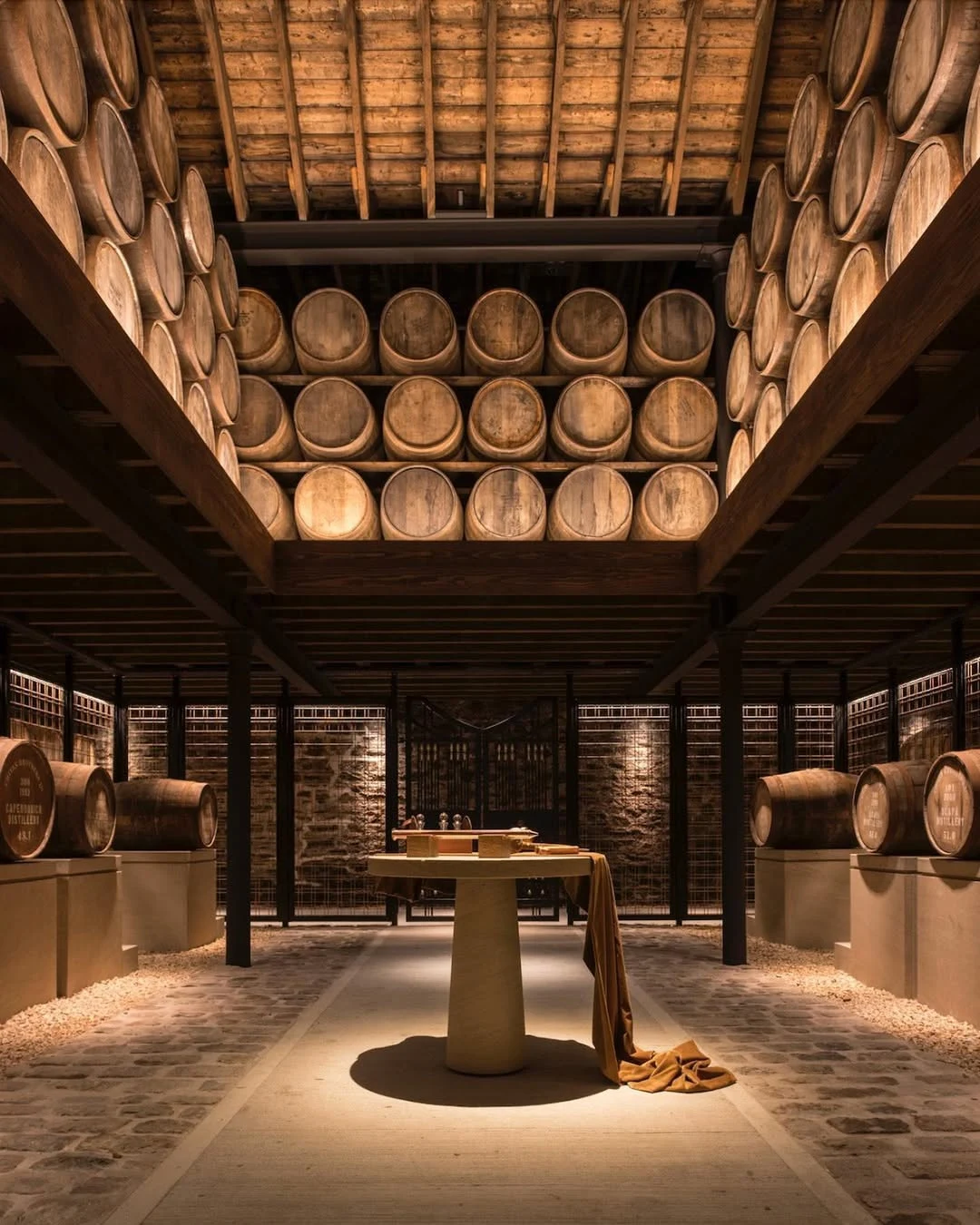 Barrels stored in a refined cellar representing patience, value and stewardship